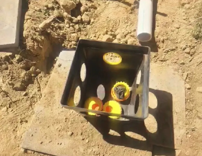 An open distribution box with flow equalizers.